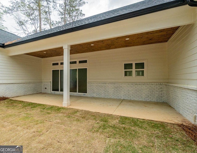 502 Camp Lake Rd, Monroe, GA 30655 - back of house with brick siding, a patio, and a yard