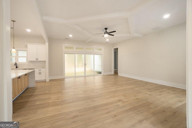 502 Camp Lake Rd, Monroe, GA 30655 - unfurnished living room with ceiling fan, recessed lighting, light wood finished floors, baseboards, and beam ceiling