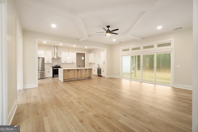 502 Camp Lake Rd, Monroe, GA 30655 - unfurnished living room featuring a ceiling fan, recessed lighting, light wood-style floors, baseboards, and beam ceiling