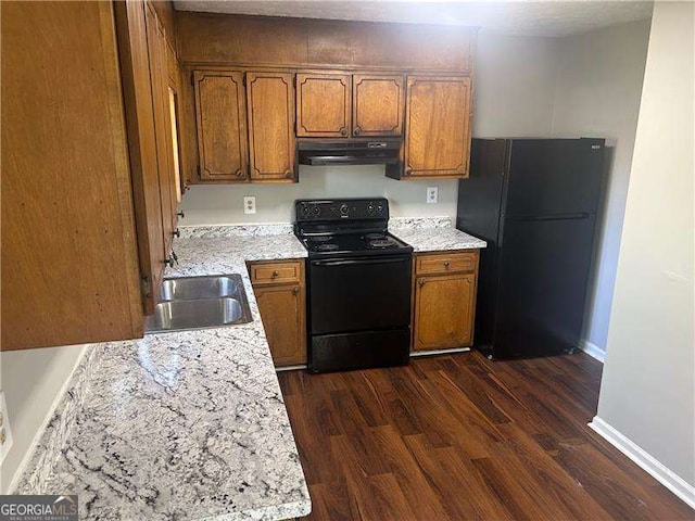 2039 Corners Cir, Lithonia, GA 30058 - kitchen featuring black appliances, brown cabinetry, exhaust hood, and dark wood-type flooring