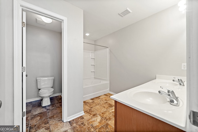 540 Ridge View Xing, Woodstock, GA 30188 - bathroom with stone tile flooring, toilet, double vanity, bathtub / shower combination, and baseboards