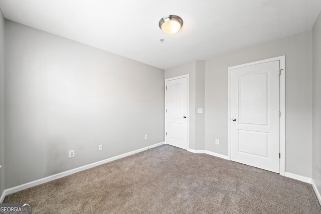 540 Ridge View Xing, Woodstock, GA 30188 - unfurnished bedroom with carpet floors and baseboards