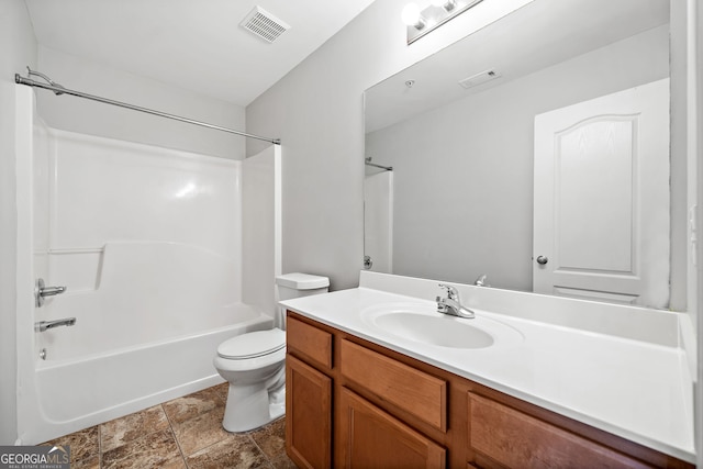 540 Ridge View Xing, Woodstock, GA 30188 - bathroom with vanity, washtub / shower combination, toilet, and stone finish flooring