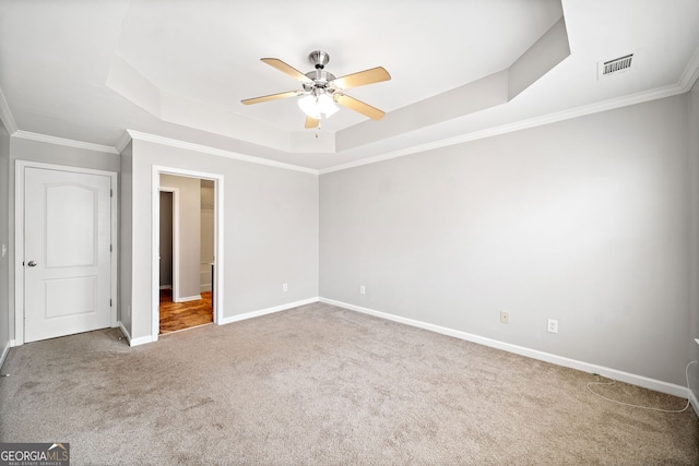 540 Ridge View Xing, Woodstock, GA 30188 - unfurnished bedroom with a raised ceiling, carpet flooring, baseboards, crown molding, and a ceiling fan