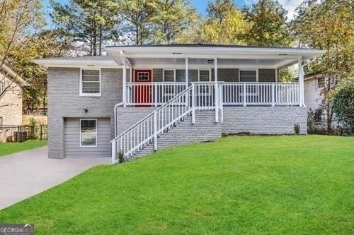 619 Church St NW, Atlanta, GA 30318 - view of front of home featuring a front lawn, stairs, and a porch