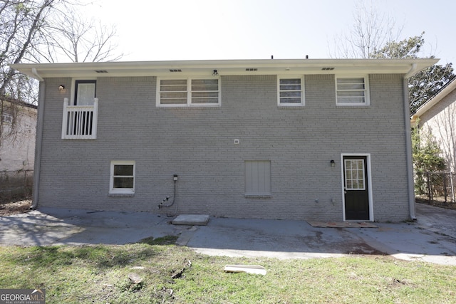 619 Church St NW, Atlanta, GA 30318 - rear view of property featuring brick siding and a patio area