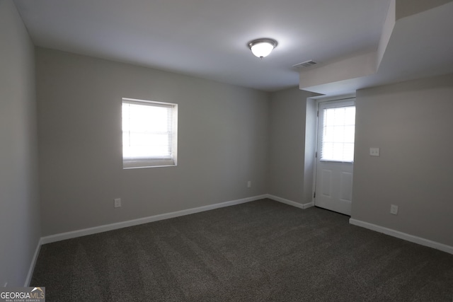 619 Church St NW, Atlanta, GA 30318 - unfurnished room with baseboards, visible vents, and dark colored carpet