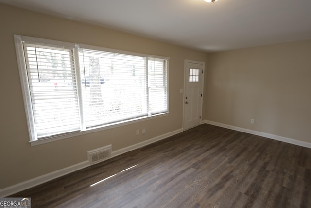 1923 Rosewood Rd, Decatur, GA 30032 - entryway with dark wood finished floors, baseboards, and visible vents