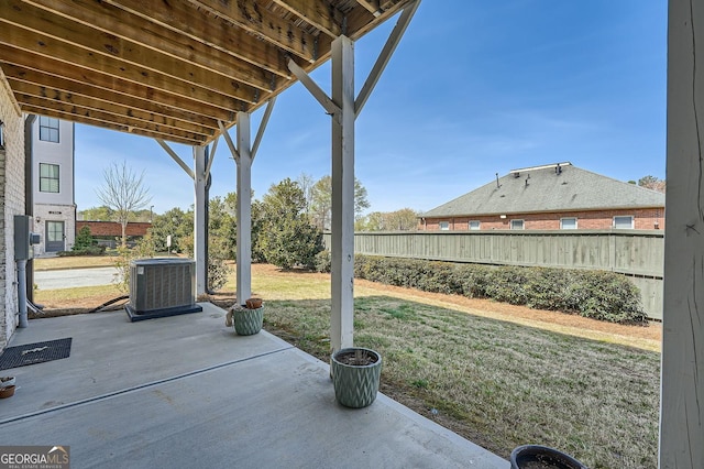view of patio with a fenced backyard and central AC