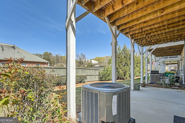 view of patio / terrace with fence and central AC