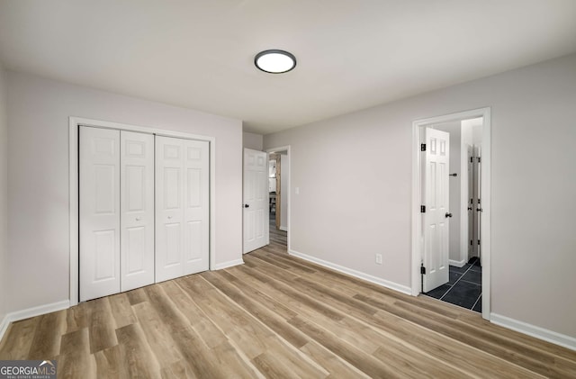 3069 Thrasher Cir, Decatur, GA 30032 - unfurnished bedroom with light wood-style floors, a closet, and ensuite bathroom