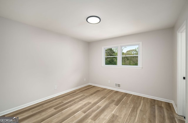 3069 Thrasher Cir, Decatur, GA 30032 - unfurnished bedroom featuring light wood-style flooring and baseboards