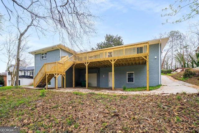 3069 Thrasher Cir, Decatur, GA 30032 - rear view of property with brick siding, a wooden deck, and stairway