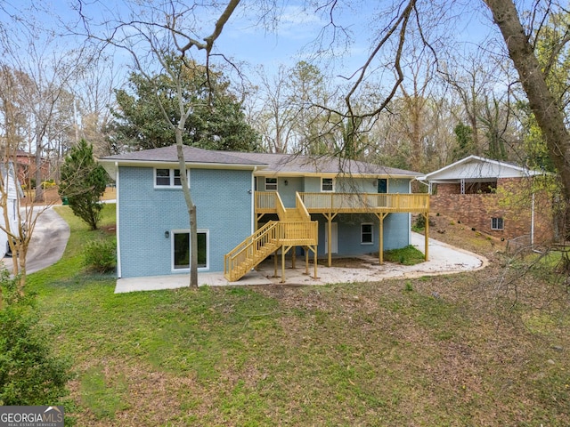 3069 Thrasher Cir, Decatur, GA 30032 - back of house with a deck, stairs, brick siding, a patio, and a yard
