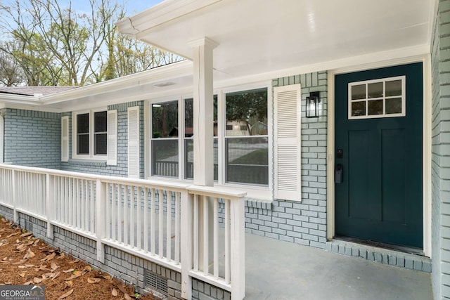 3069 Thrasher Cir, Decatur, GA 30032 - doorway to property with brick siding and covered porch