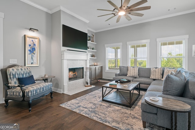 living area featuring crown molding, ceiling fan, dark wood-style floors, visible vents, and a fireplace