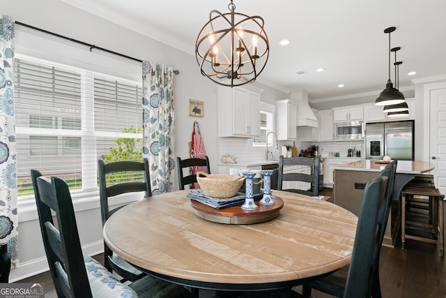 dining space with dark wood-type flooring, baseboards, ornamental molding, recessed lighting, and an inviting chandelier