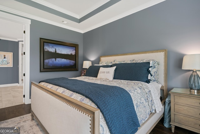 bedroom featuring baseboards, ornamental molding, and visible vents