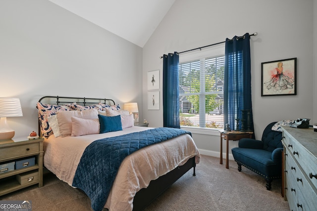 bedroom with baseboards, high vaulted ceiling, and carpet flooring