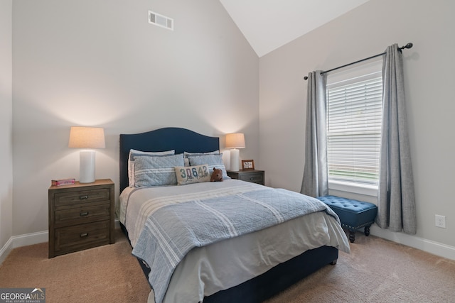 carpeted bedroom with baseboards, lofted ceiling, and visible vents