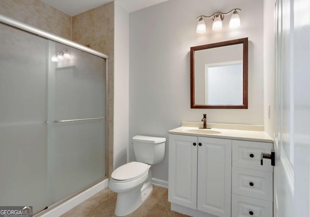 full bathroom featuring a stall shower, toilet, vanity, tile patterned flooring, and baseboards