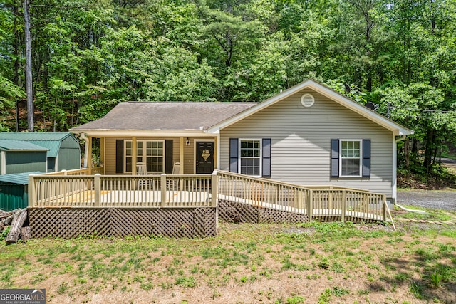 104 Nugget Ln, Ellijay, GA 30540 - view of front facade with a deck and roof with shingles