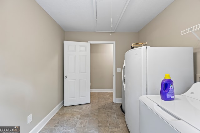 104 Nugget Ln, Ellijay, GA 30540 - laundry room with attic access, baseboards, and stone finish floors
