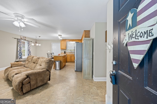 104 Nugget Ln, Ellijay, GA 30540 - living room with baseboards, ceiling fan, and a chandelier