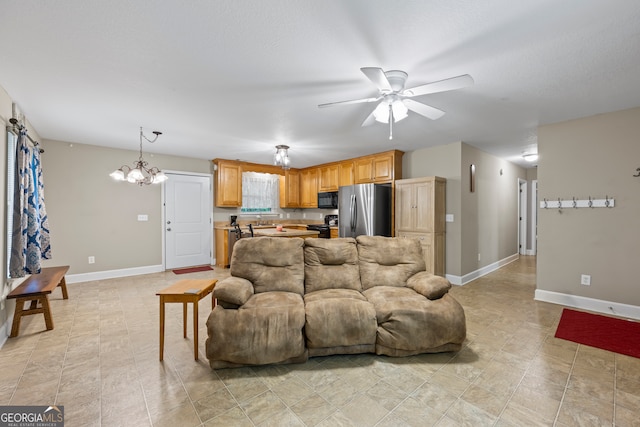 104 Nugget Ln, Ellijay, GA 30540 - living area featuring a ceiling fan, a chandelier, and baseboards