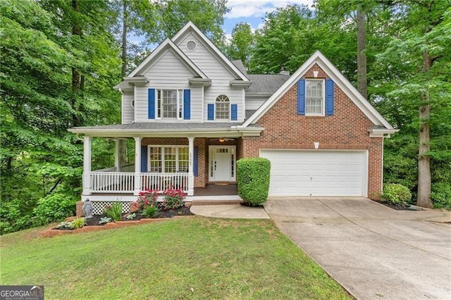 5055 Hamptons Club Dr, Alpharetta, GA 30004 - view of front facade with brick siding, covered porch, concrete driveway, a front yard, and an attached garage