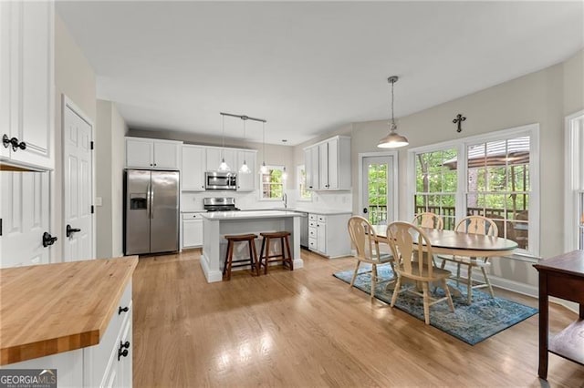 5055 Hamptons Club Dr, Alpharetta, GA 30004 - dining area featuring light wood-type flooring