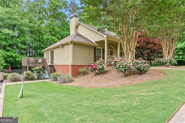 5055 Hamptons Club Dr, Alpharetta, GA 30004 - view of property exterior with a lawn, a chimney, a deck, brick siding, and stairs