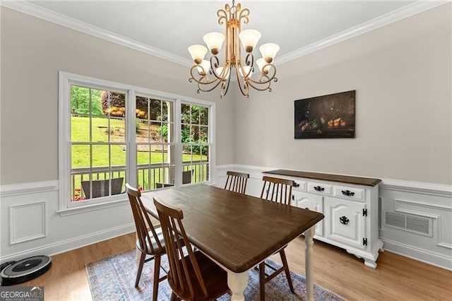 5055 Hamptons Club Dr, Alpharetta, GA 30004 - dining area with a chandelier, ornamental molding, a wainscoted wall, and light wood finished floors