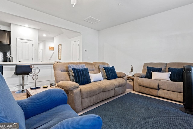 living area featuring visible vents