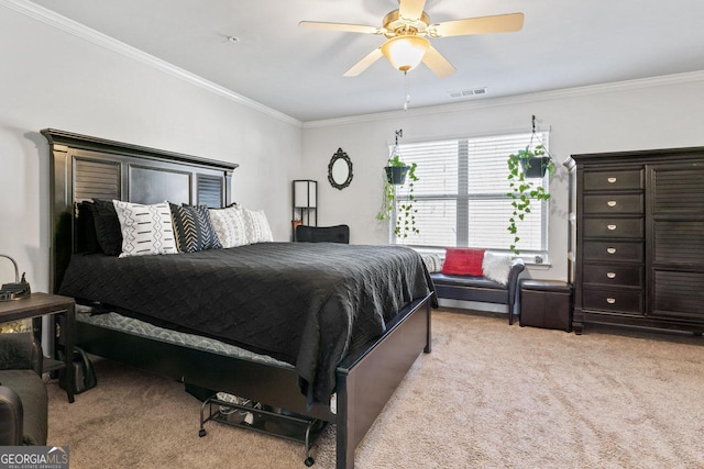 bedroom featuring light colored carpet, visible vents, crown molding, and a ceiling fan