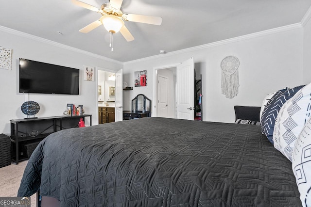 bedroom featuring ensuite bathroom, ornamental molding, carpet flooring, and a ceiling fan