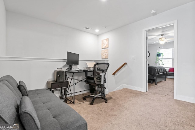 office area featuring baseboards, visible vents, carpet floors, and a ceiling fan