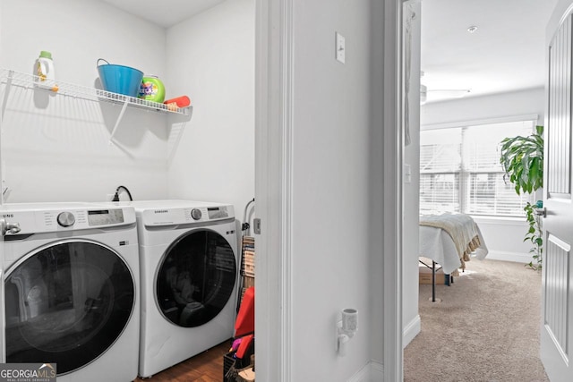 laundry room featuring baseboards, carpet flooring, laundry area, and washer and dryer