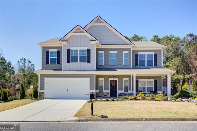 190 Crown Pointe Dr, Dawsonville, GA 30534 - craftsman-style home with concrete driveway, a porch, a front yard, board and batten siding, and an attached garage