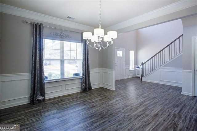 190 Crown Pointe Dr, Dawsonville, GA 30534 - unfurnished dining area with a chandelier, dark wood-style floors, stairway, a wainscoted wall, and crown molding