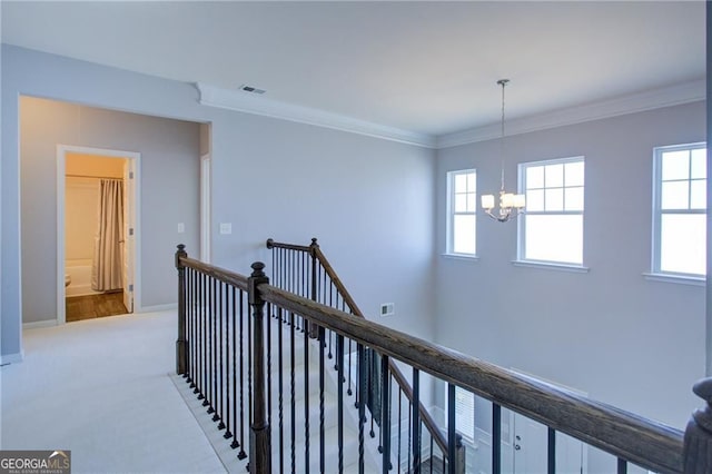 190 Crown Pointe Dr, Dawsonville, GA 30534 - corridor featuring an upstairs landing, a chandelier, crown molding, carpet, and baseboards
