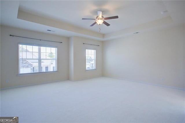190 Crown Pointe Dr, Dawsonville, GA 30534 - carpeted spare room featuring a raised ceiling, a ceiling fan, and baseboards