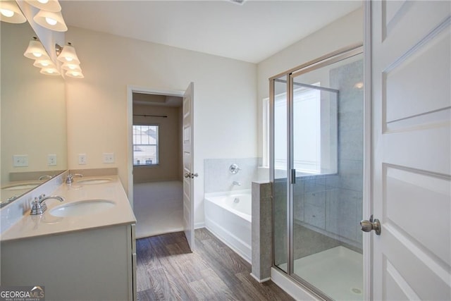 190 Crown Pointe Dr, Dawsonville, GA 30534 - bathroom with a bath, double vanity, wood finished floors, a stall shower, and a chandelier