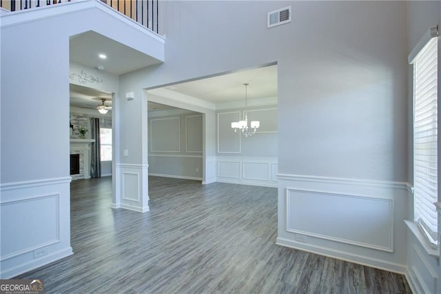 190 Crown Pointe Dr, Dawsonville, GA 30534 - spare room featuring a decorative wall, healthy amount of natural light, a chandelier, wood finished floors, and ornamental molding