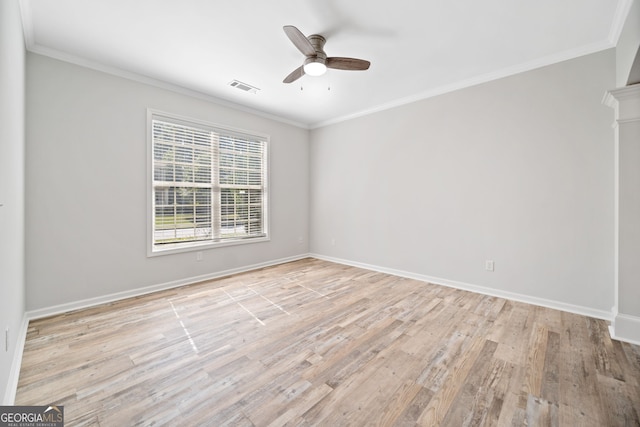 unfurnished room featuring ceiling fan, visible vents, crown molding, and light wood finished floors