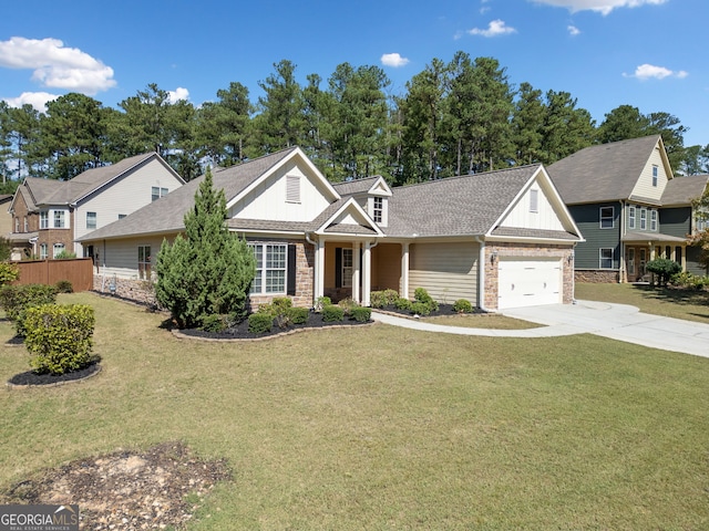 view of front of home featuring driveway, a front yard, roof with shingles, fence, and a garage