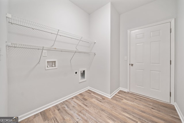 clothes washing area with washer hookup, light wood-style floors, laundry area, and electric dryer hookup