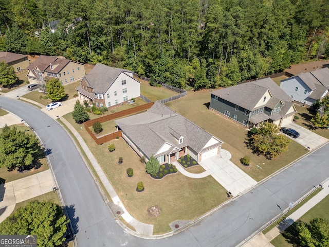 aerial view featuring a residential view and a forest view