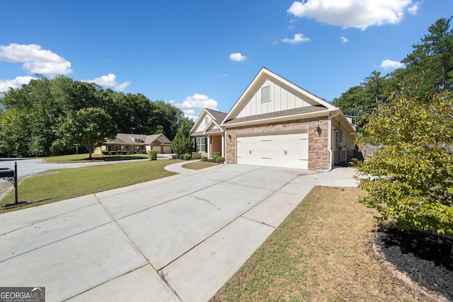 view of front of home featuring board and batten siding, a front yard, driveway, and a garage