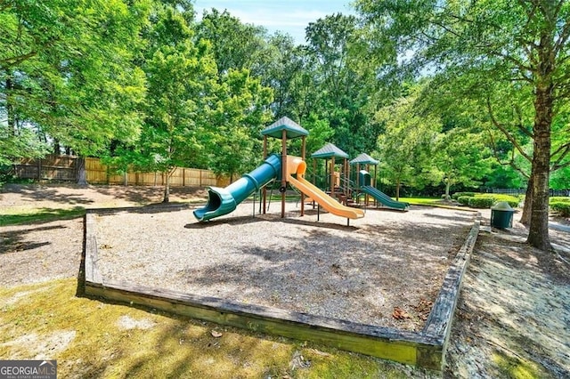 community jungle gym featuring fence